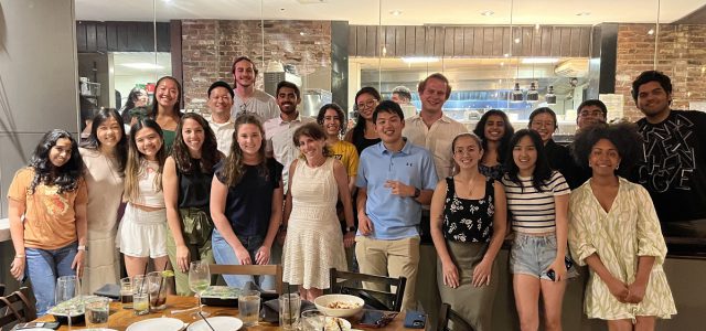 Members of Goizueta BBA Case Competition teams pose with faculty at a celebratory dinner.