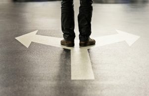Feet and two arrows painted on floor.